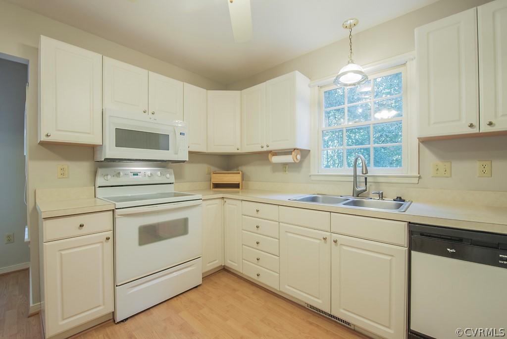 10400 White Rabbit Road North Chesterfield, VA 23235 - Photo 27 of 50 a kitchen with white cabinets and white appliances