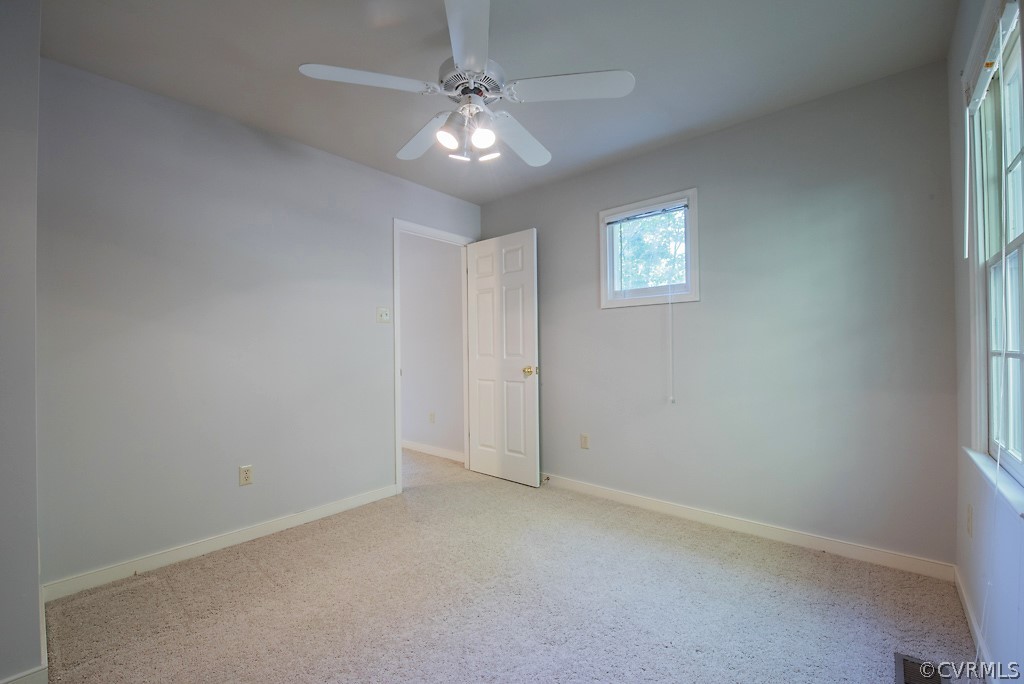 10400 White Rabbit Road North Chesterfield, VA 23235 - Photo 30 of 50 an empty room with a chandelier fan