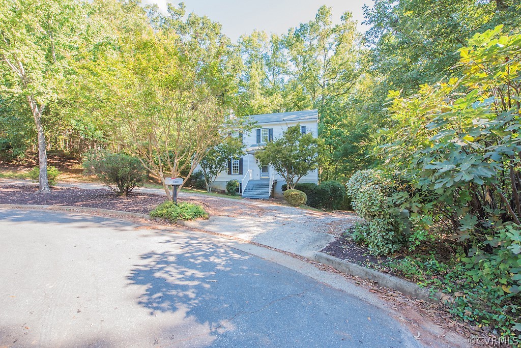 10400 White Rabbit Road North Chesterfield, VA 23235 - Photo 3 of 50 a view of a house with a tree and plants