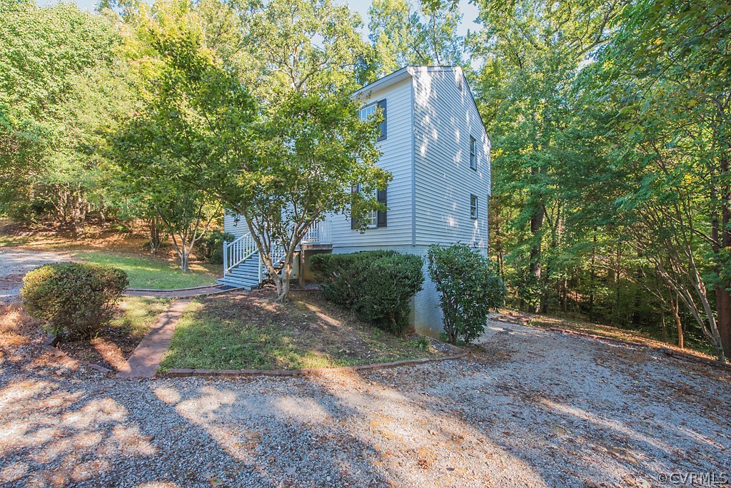 10400 White Rabbit Road North Chesterfield, VA 23235 - Photo 8 of 50 a view of a tall building with large trees