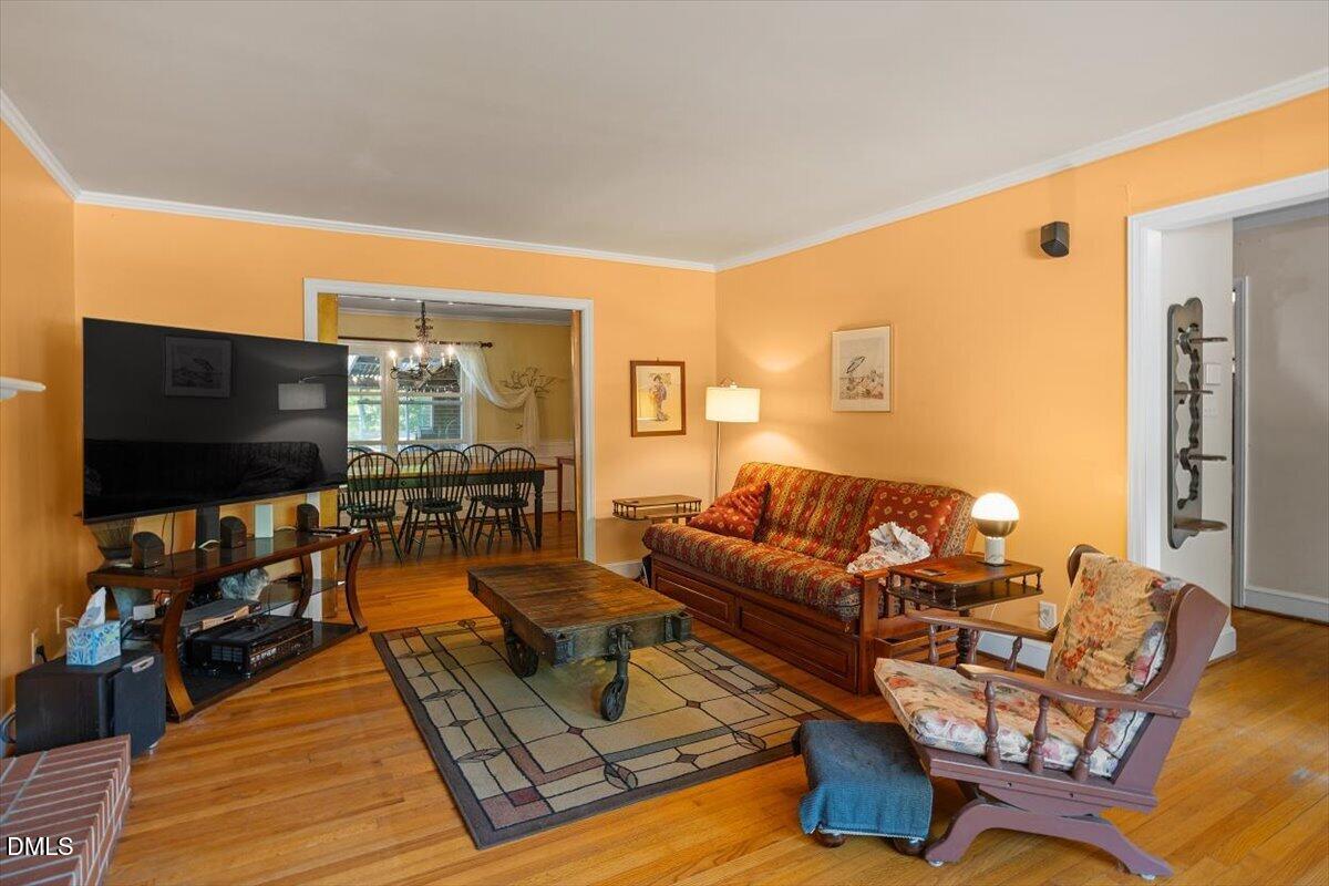 3107 Dixon Road Durham, NC 27707 - Photo 5 of 35 a living room with furniture and a flat screen tv