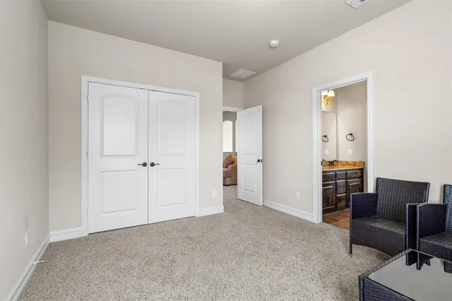 a view of a livingroom with furniture and a cabinet