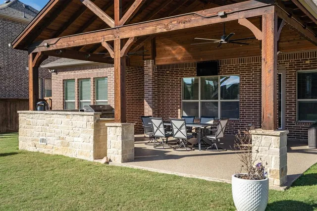 a view of a house with outdoor seating