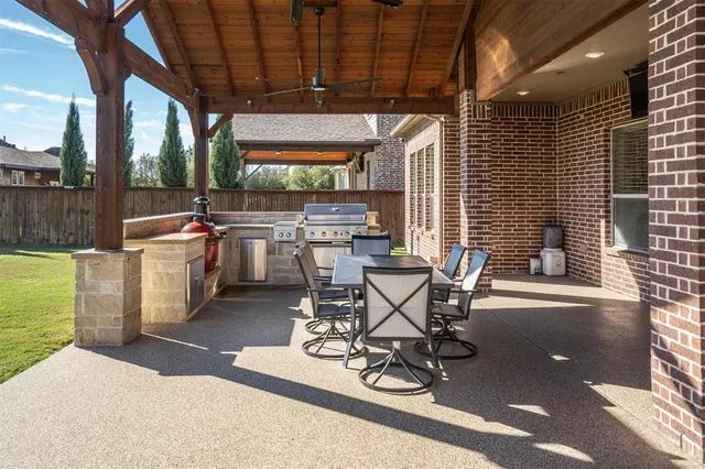 a view of a chairs and table in a patio