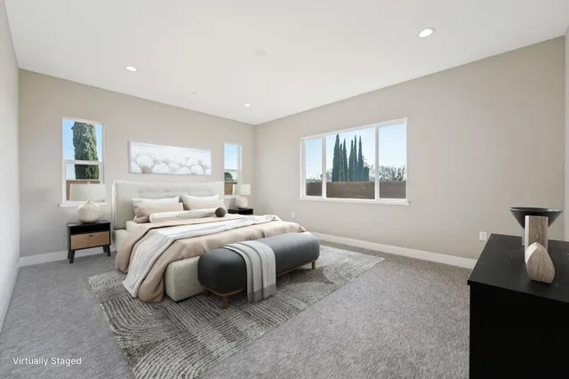 a bedroom with bed and window