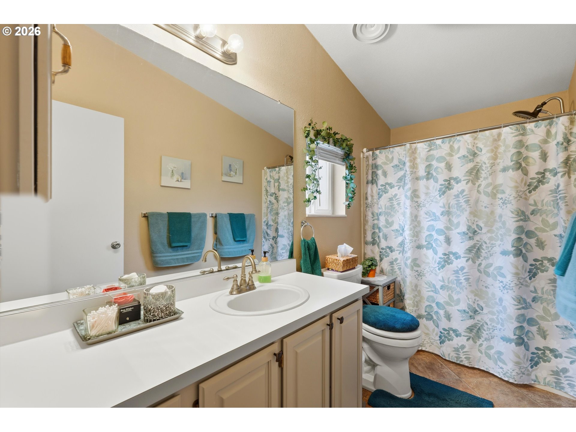 369 Gun Club Road, Unit 88 Woodland, WA 98674 - Photo 12 of 17 a bathroom with a sink and a mirror