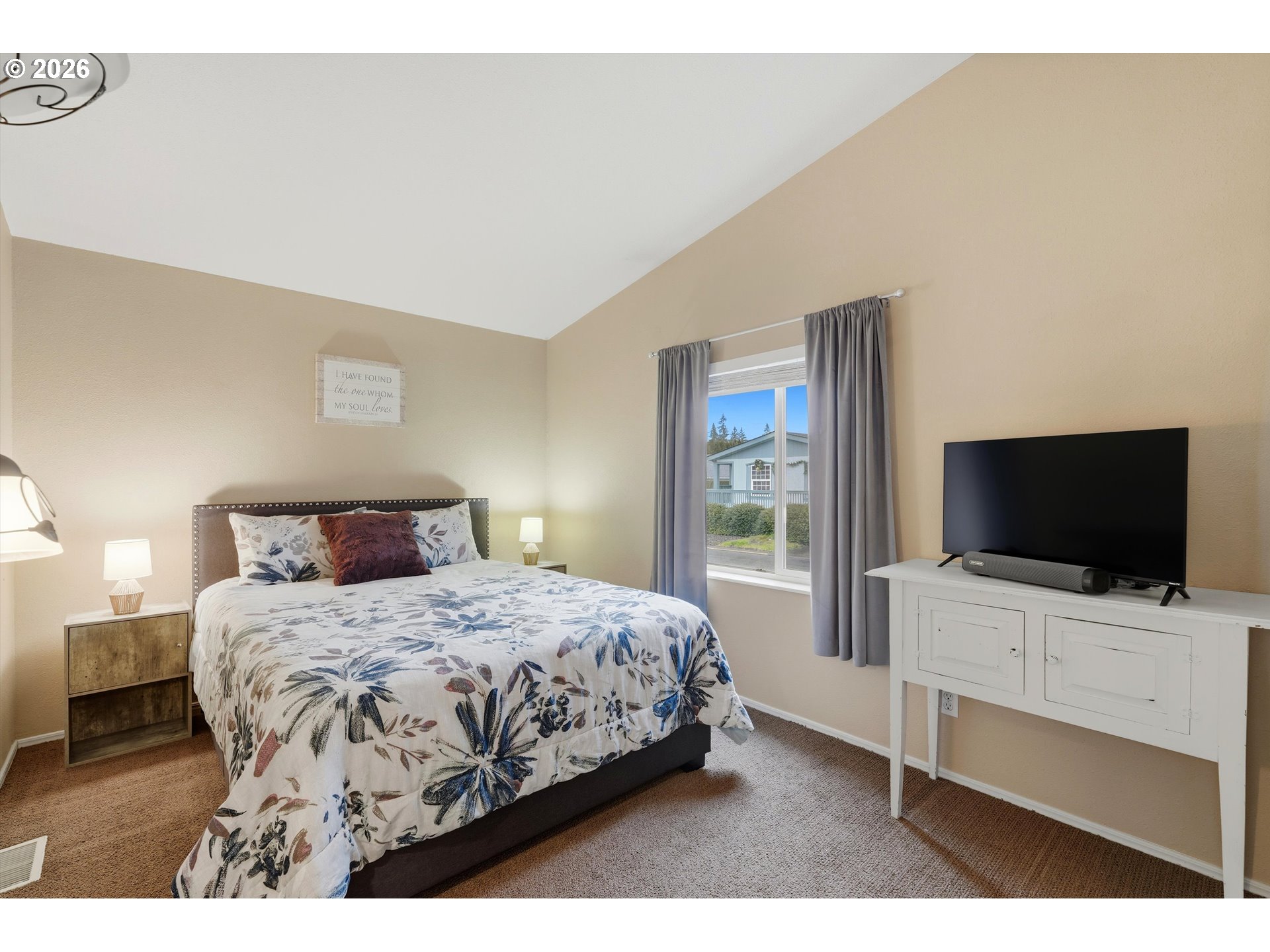 369 Gun Club Road, Unit 88 Woodland, WA 98674 - Photo 13 of 17 a bedroom with a bed and a flat screen tv