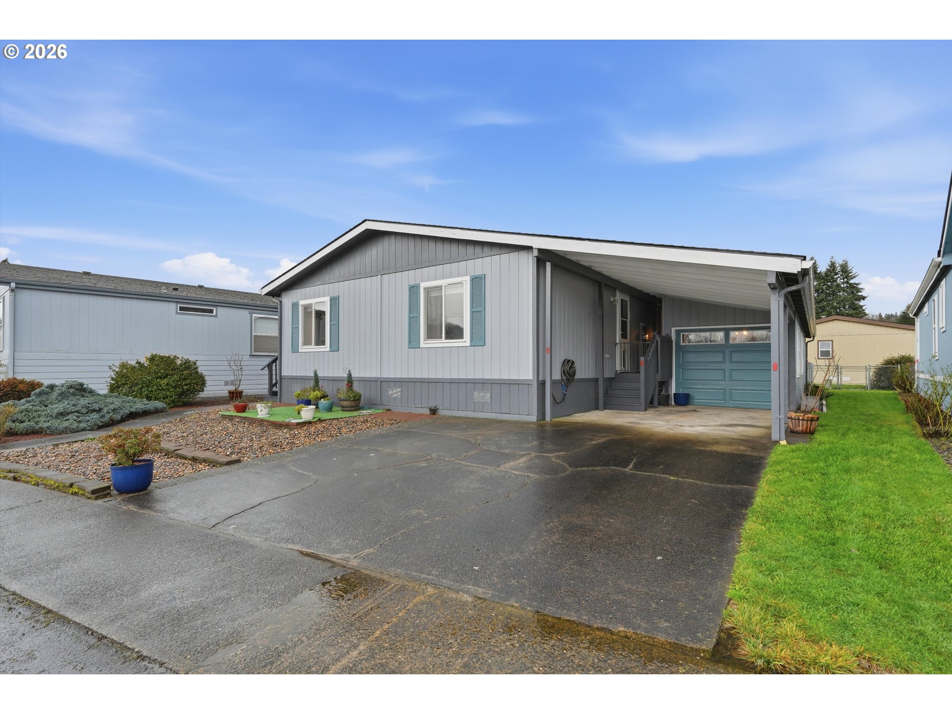 369 Gun Club Road, Unit 88 Woodland, WA 98674 - Photo 2 of 17 a backyard of a house with table and chairs