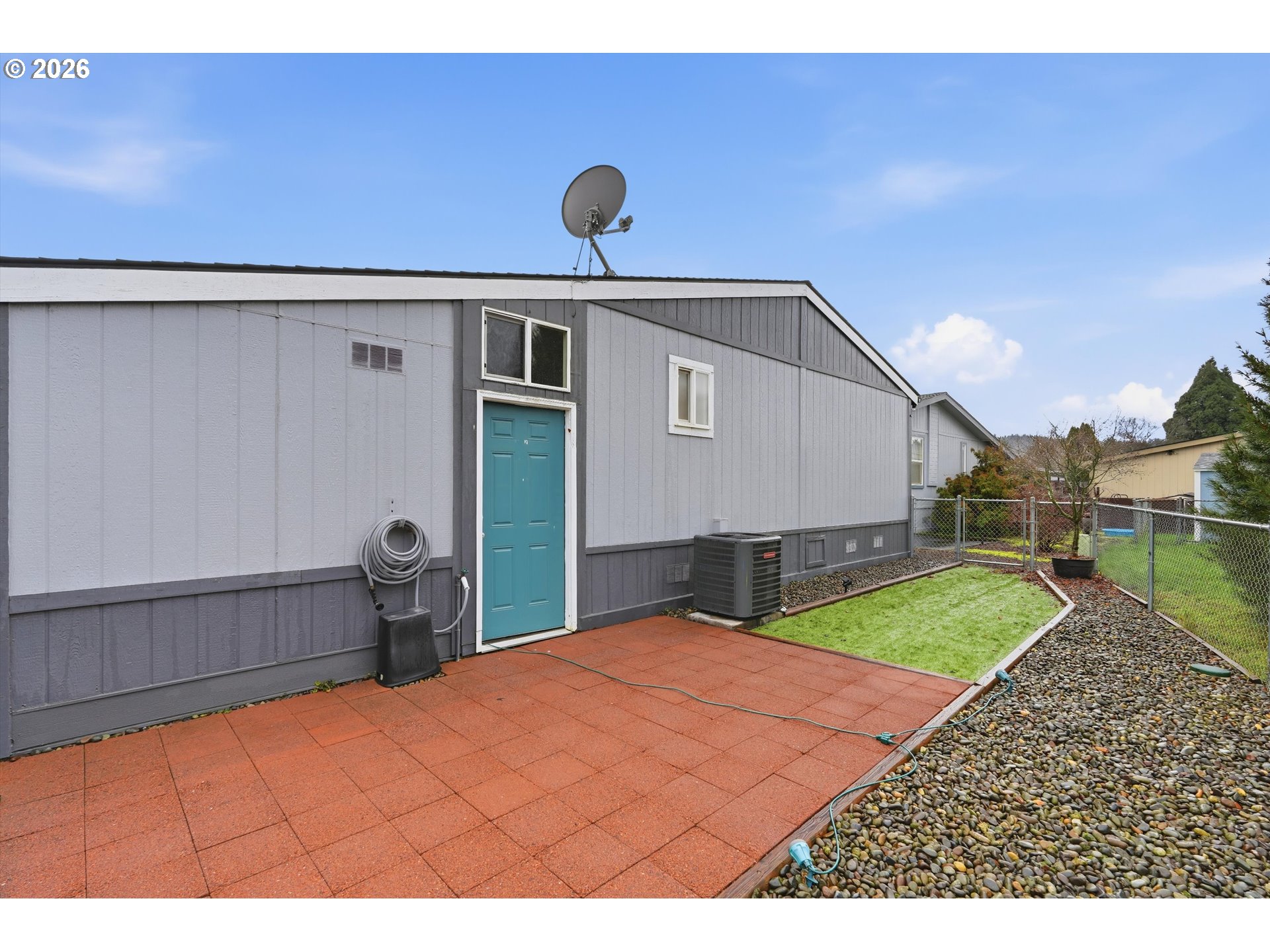 369 Gun Club Road, Unit 88 Woodland, WA 98674 - Photo 3 of 17 a house view with a backyard space