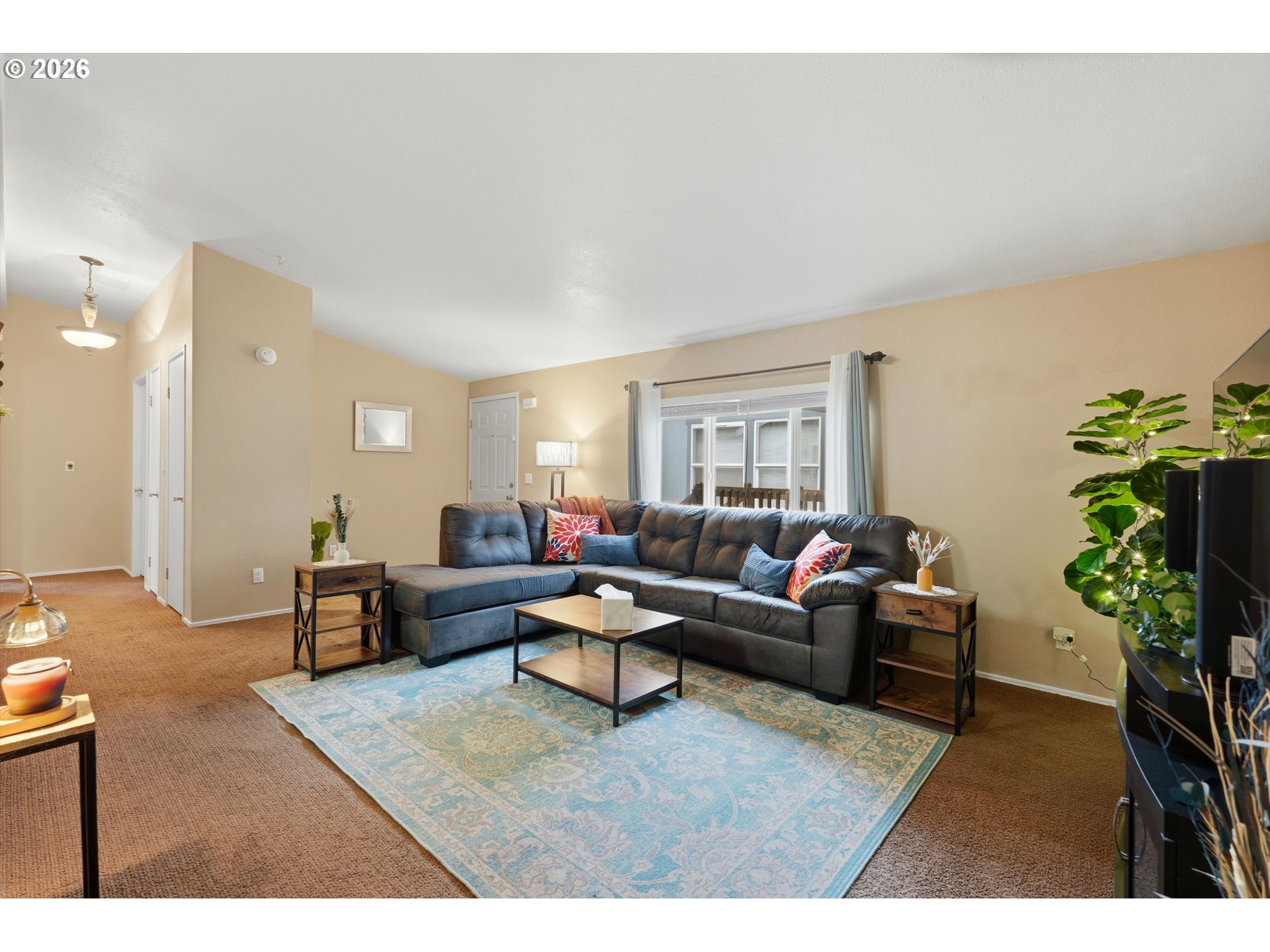 369 Gun Club Road, Unit 88 Woodland, WA 98674 - Photo 4 of 17 a living room with furniture potted plant and a window