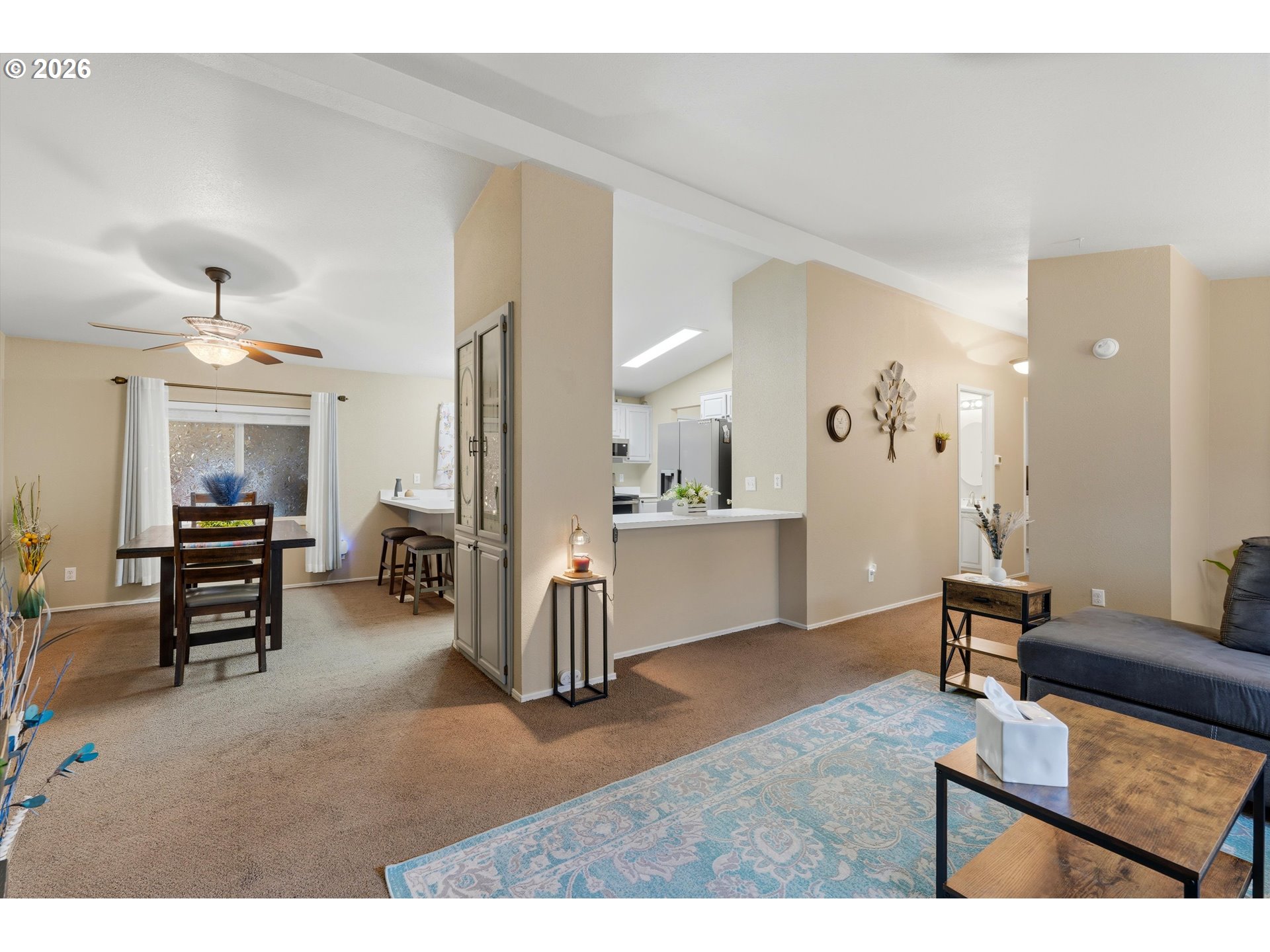369 Gun Club Road, Unit 88 Woodland, WA 98674 - Photo 6 of 17 a living room with furniture a dining table and chairs