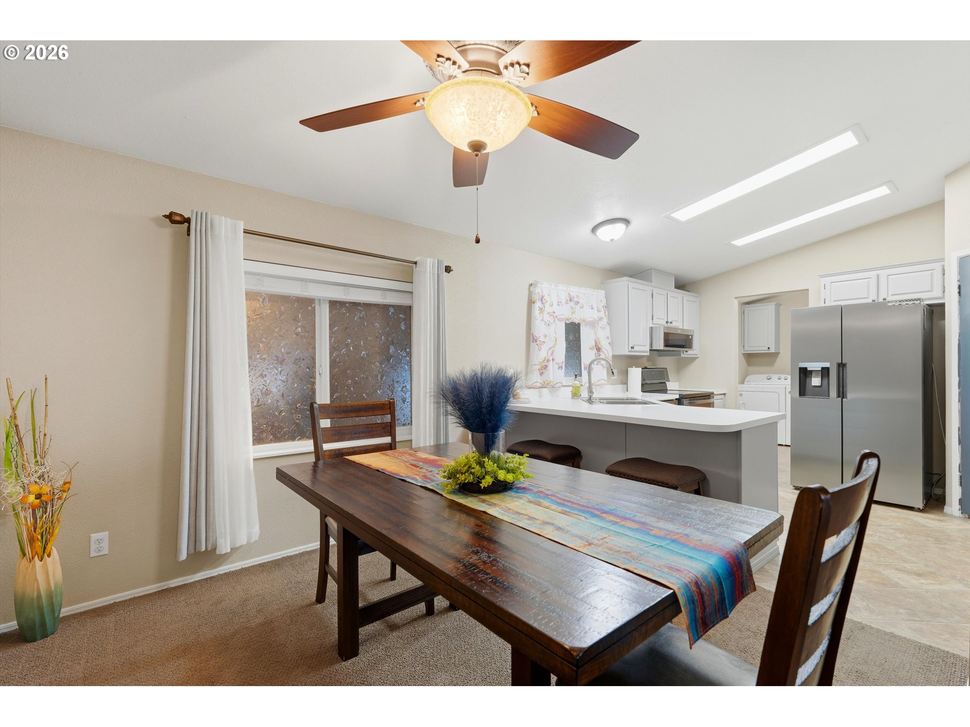 369 Gun Club Road, Unit 88 Woodland, WA 98674 - Photo 9 of 17 a view of a dining room with furniture