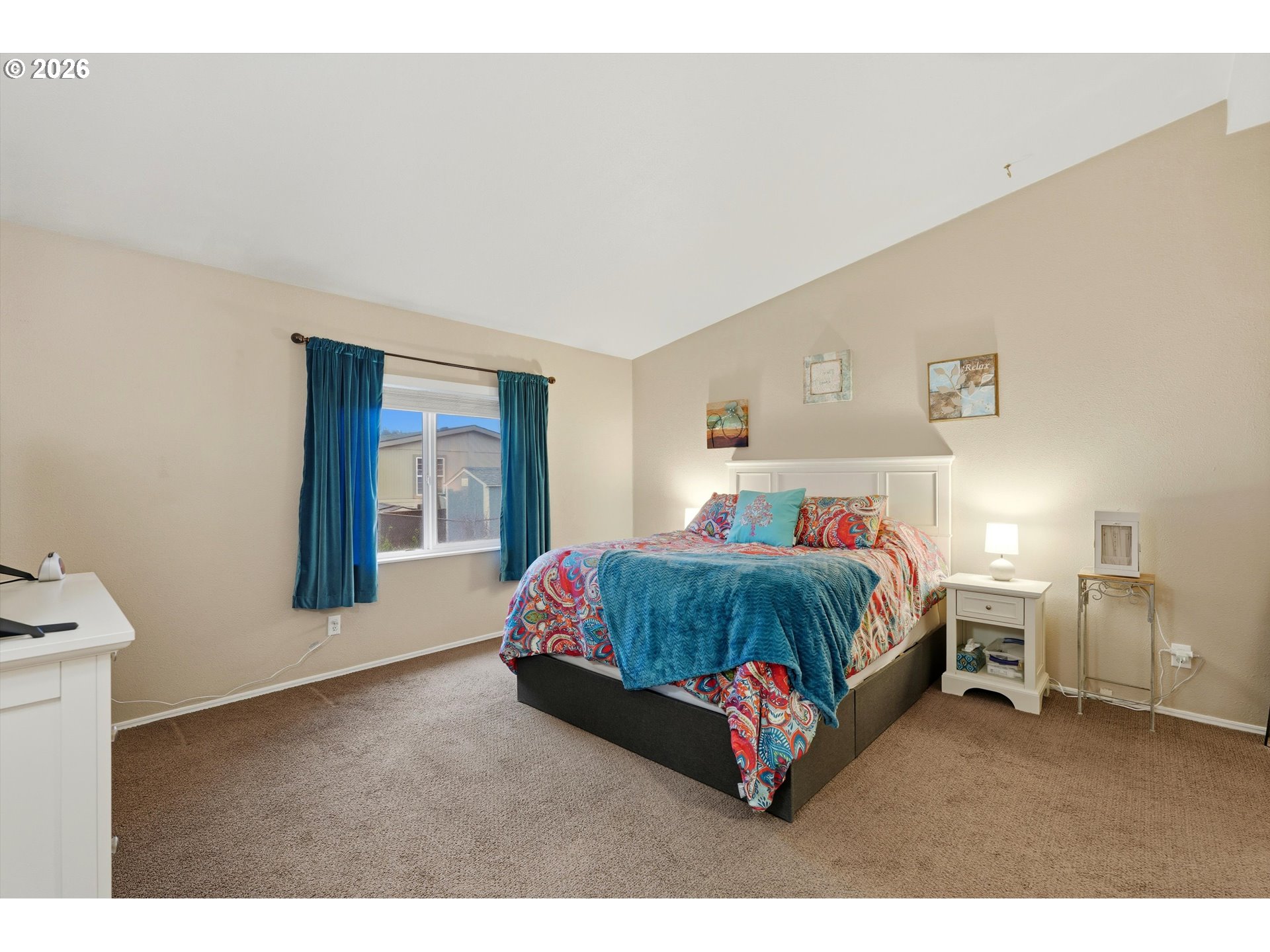369 Gun Club Road, Unit 88 Woodland, WA 98674 - Photo 10 of 17 a spacious bedroom with a bed table and a window
