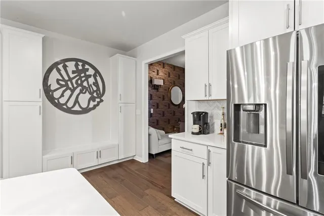 a kitchen with stainless steel appliances a refrigerator and a stove