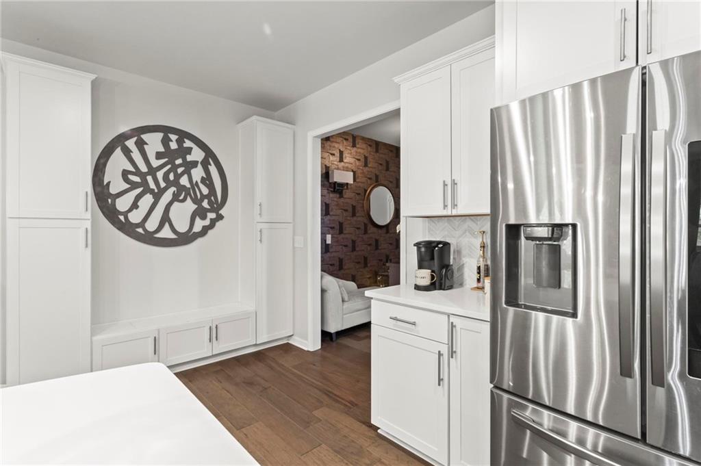 113 Poppy Street McDonough, GA 30253 - Photo 11 of 36 a kitchen with stainless steel appliances a refrigerator and a stove