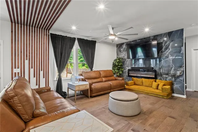 a living room with furniture and a large window