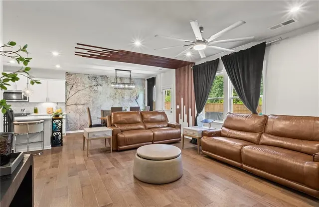 a living room with furniture and a large window