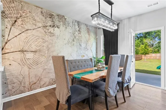 a view of a dining room with furniture window and outside view
