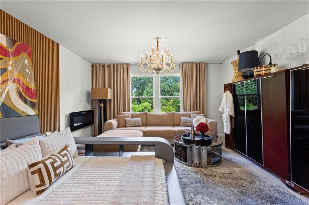 113 Poppy Street McDonough, GA 30253 - Photo 19 of 36 a living room with furniture and a flat screen tv