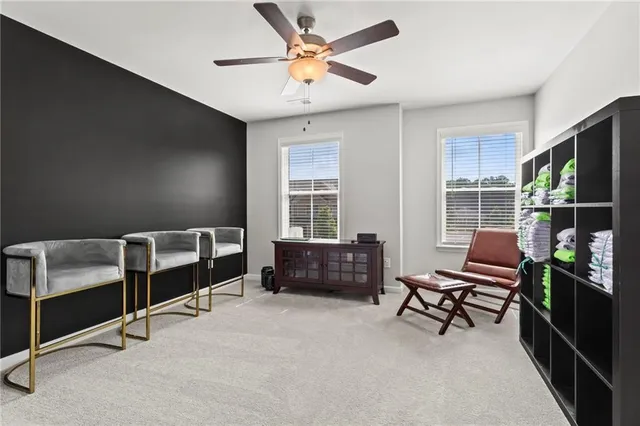 a bedroom with furniture and a window