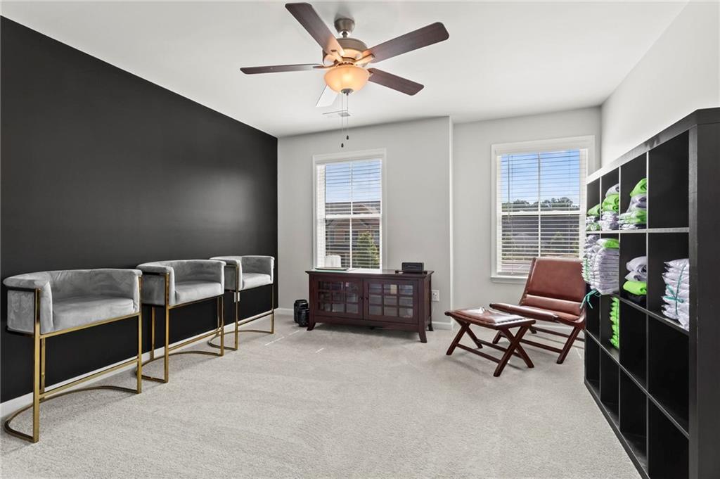 113 Poppy Street McDonough, GA 30253 - Photo 26 of 36 a bedroom with furniture and a window