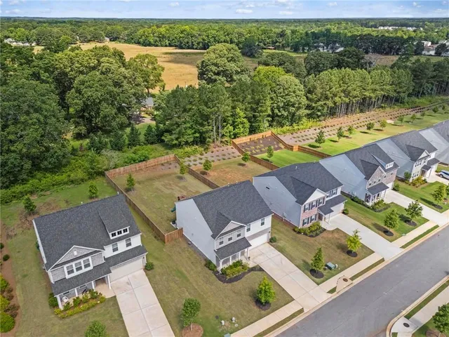 an aerial view of a house with a lake view