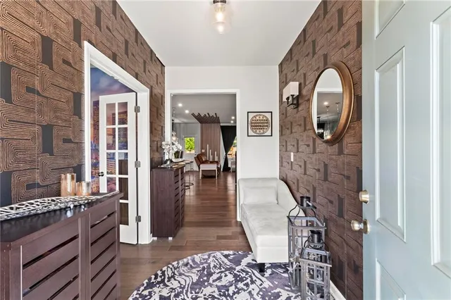 a view of living room kitchen and entryway