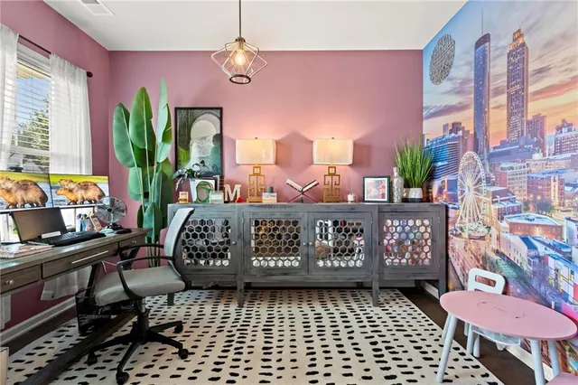 a view of a room with furniture and a window