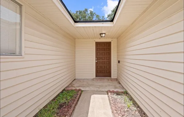 a view of house with backyard