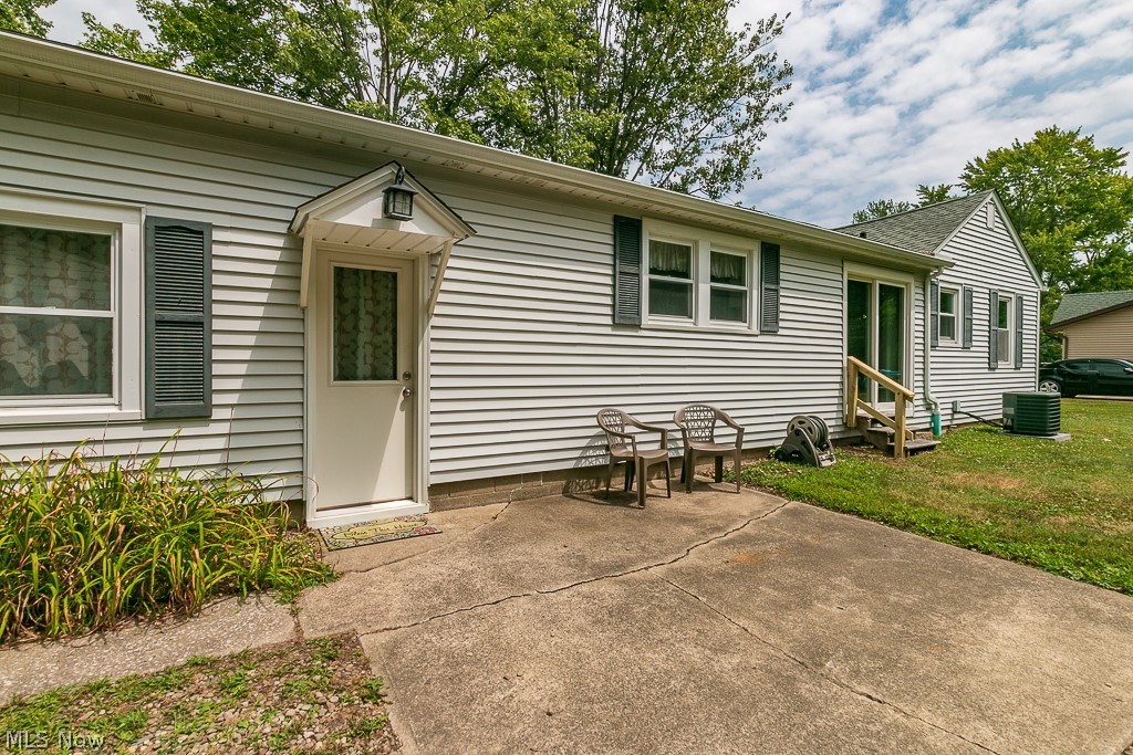 38488 Bell Road Willoughby, OH 44094 - Photo 16 of 22 View of front of home with a patio, central air condition unit, and a front yard