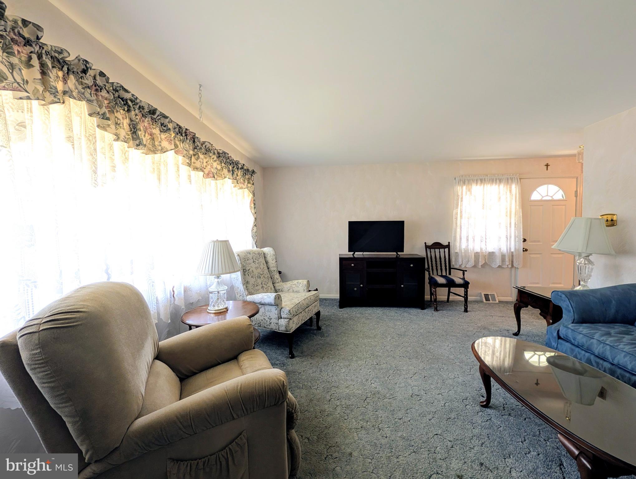 1439 Michigan Avenue Swarthmore, PA 19081 - Photo 13 of 54 a living room with furniture and a flat screen tv