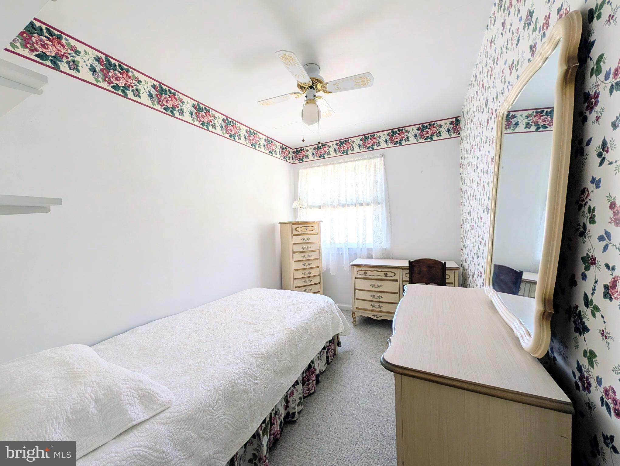 1439 Michigan Avenue Swarthmore, PA 19081 - Photo 16 of 54 a bedroom with a bed and a chandelier