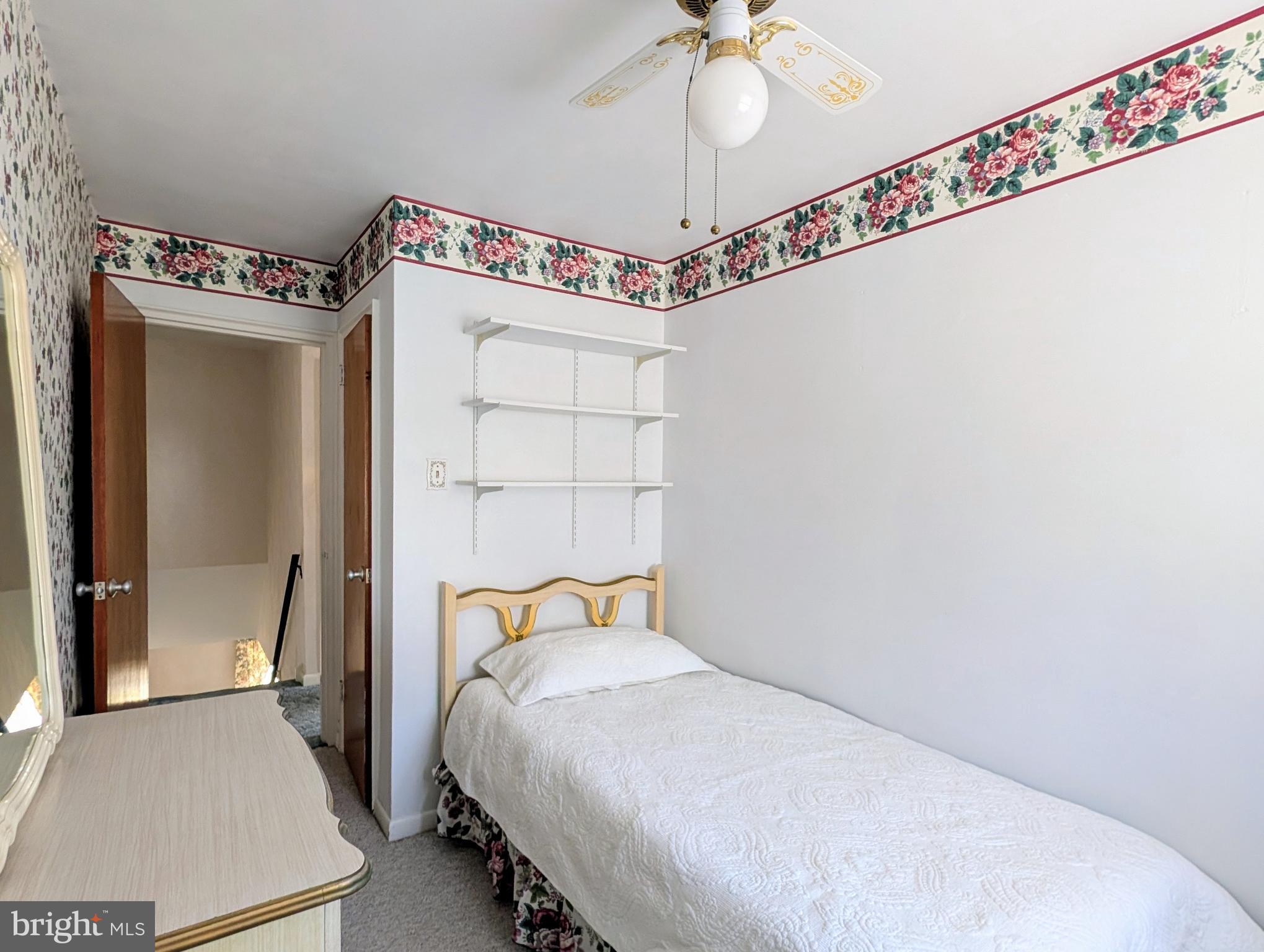 1439 Michigan Avenue Swarthmore, PA 19081 - Photo 18 of 54 a bedroom with a bed and a chandelier