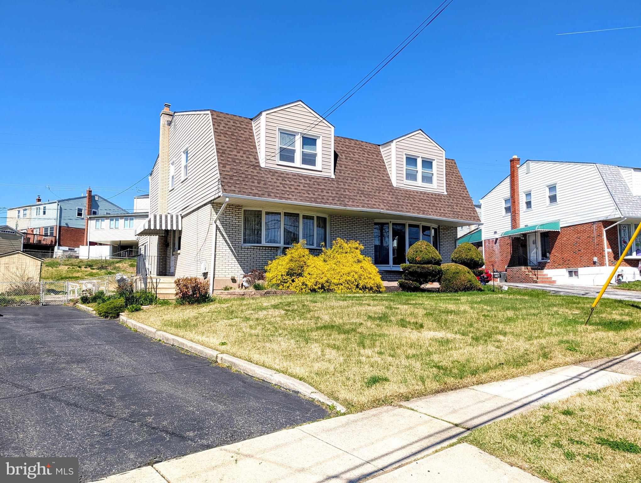 1439 Michigan Avenue Swarthmore, PA 19081 - Photo 2 of 54 a front view of a house with a yard fountain