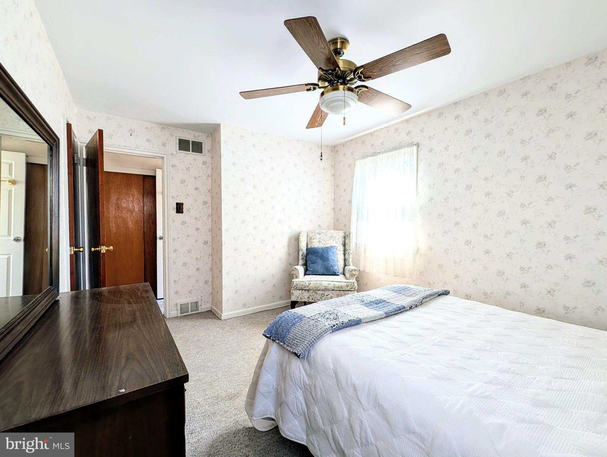 1439 Michigan Avenue Swarthmore, PA 19081 - Photo 25 of 54 a bedroom with a large bed and a chandelier