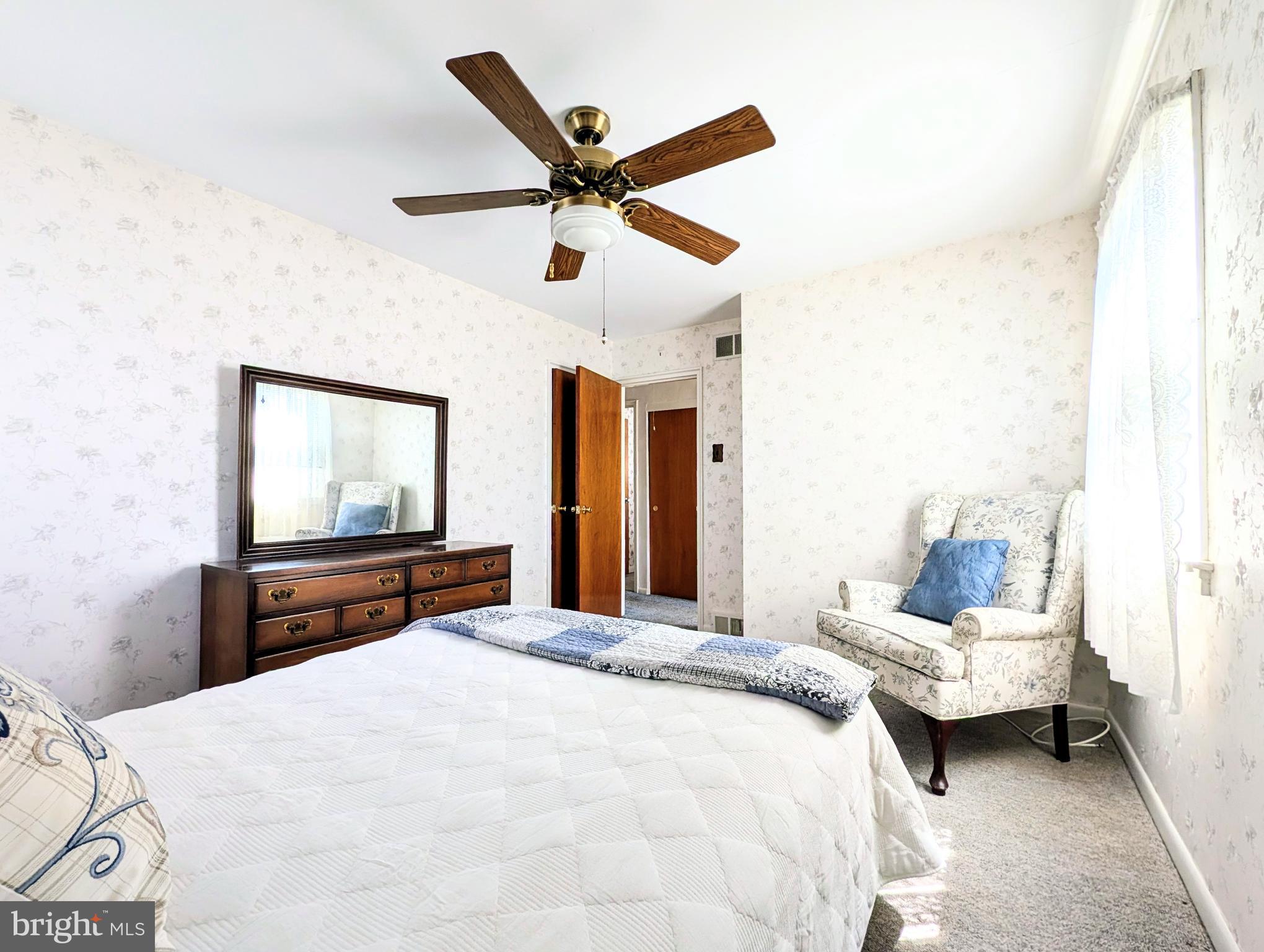 1439 Michigan Avenue Swarthmore, PA 19081 - Photo 26 of 54 a bedroom with a bed and a chandelier