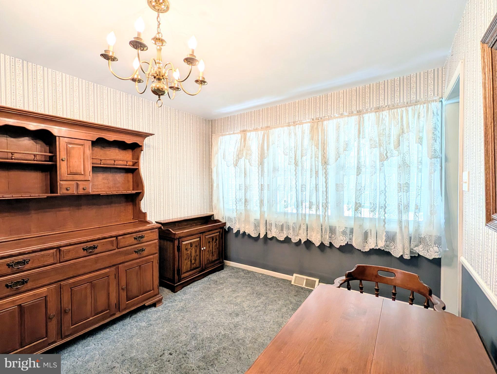 1439 Michigan Avenue Swarthmore, PA 19081 - Photo 33 of 54 a bedroom with a bed and a chandelier