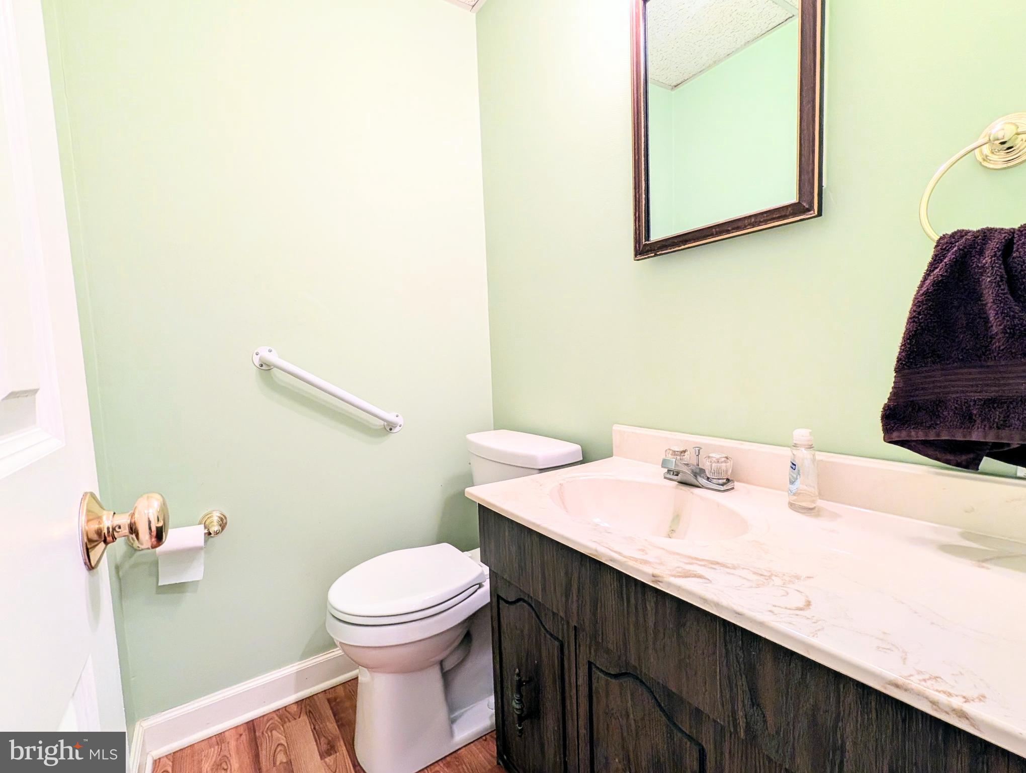 1439 Michigan Avenue Swarthmore, PA 19081 - Photo 40 of 54 a bathroom with a sink a toilet and mirror