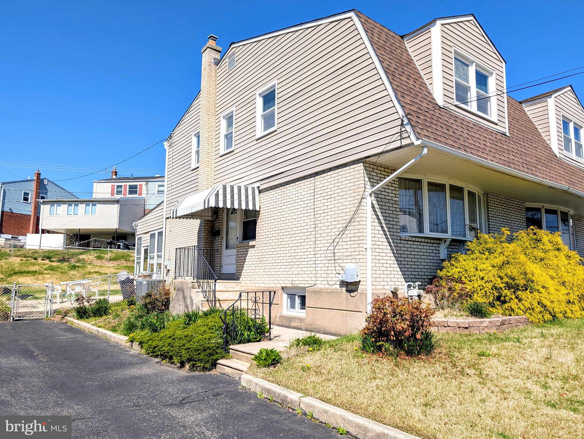 1439 Michigan Avenue Swarthmore, PA 19081 - Photo 4 of 54 a front view of a house with a yard