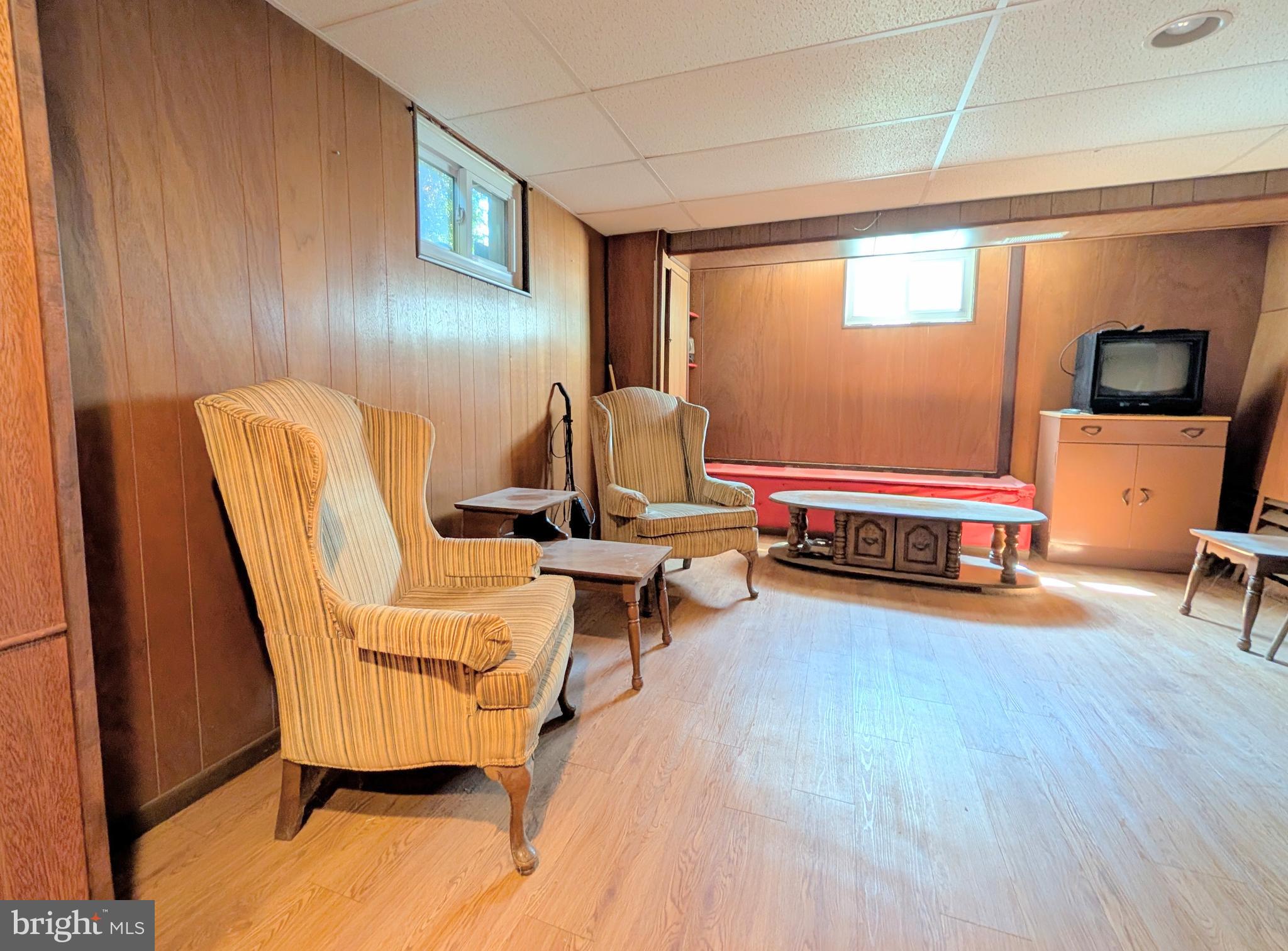 1439 Michigan Avenue Swarthmore, PA 19081 - Photo 43 of 54 a living room with furniture and a wooden floor
