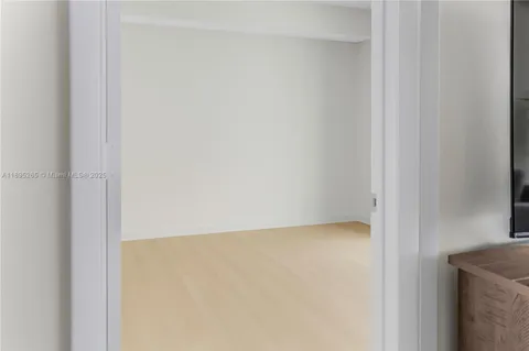 a bedroom with a bed and with a mirror