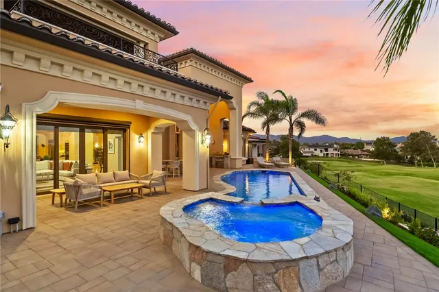 a living room with furniture a rug and white walls