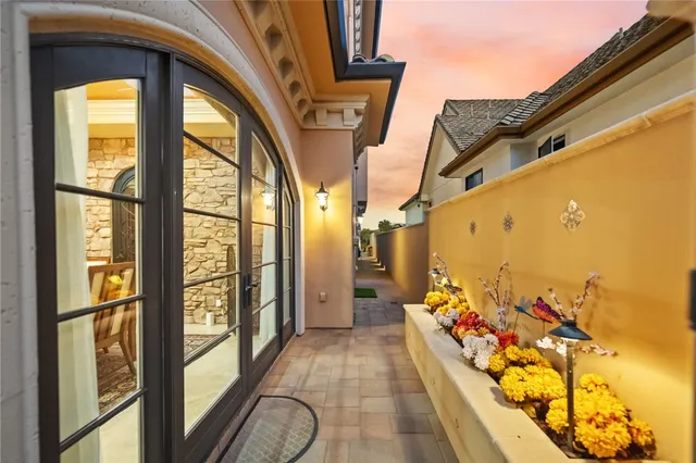 a view of a dining room with furniture and a chandelier