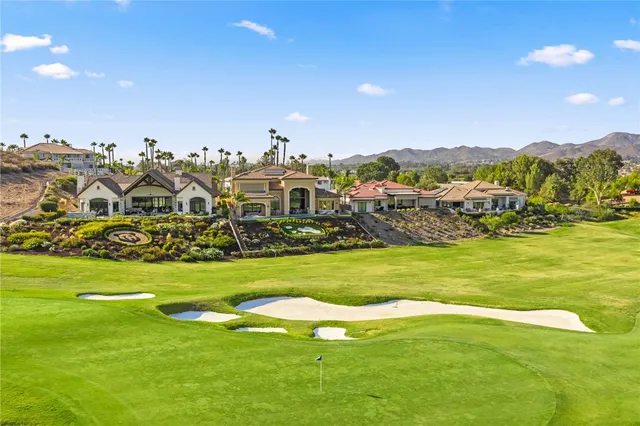 a kitchen with granite countertop a sink stove and cabinets
