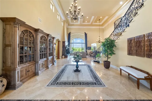 a bed room with furniture and a large window