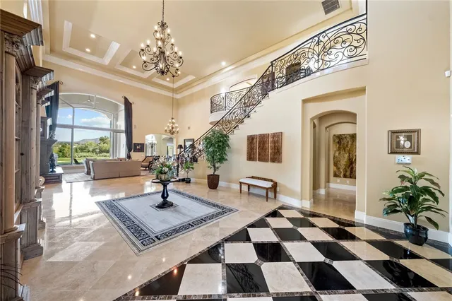 a spacious bathroom with a granite countertop sink and a mirror