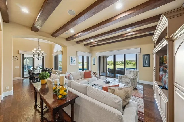 a spacious bedroom with a bed a desk and chair