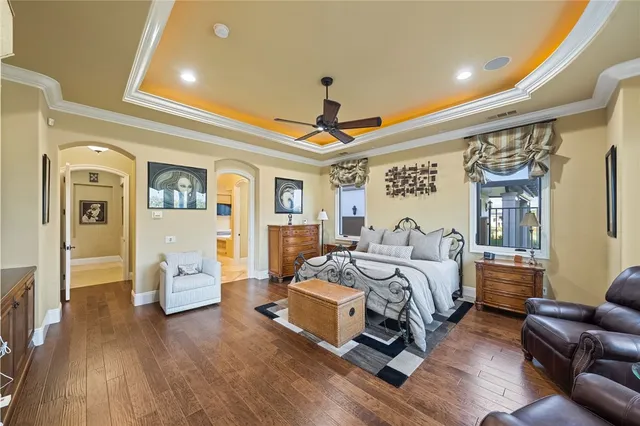 a living room with furniture a rug and a large window