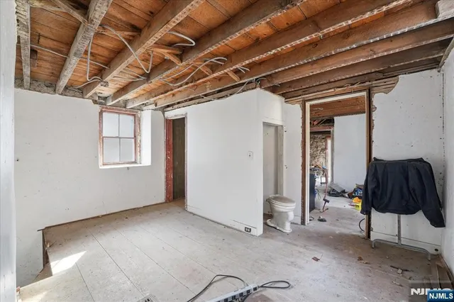 a view of a storage room with wooden floor