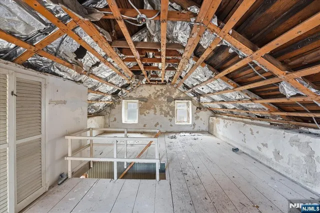 a view of a house with a yard and sitting area